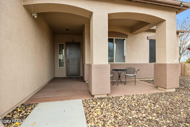 entrance to property with a patio area