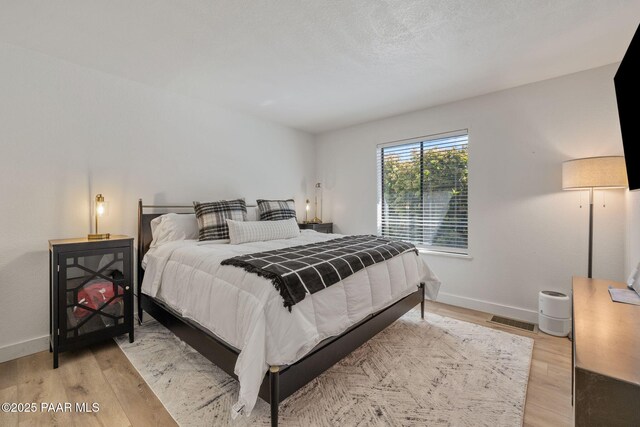 4361 N Covina Cir, Prescott Valley, AZ 86314 - bedroom featuring light wood finished floors and baseboards
