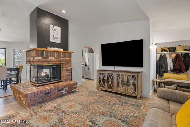 4361 N Covina Cir, Prescott Valley, AZ 86314 - living room featuring wood finished floors, a fireplace, and recessed lighting