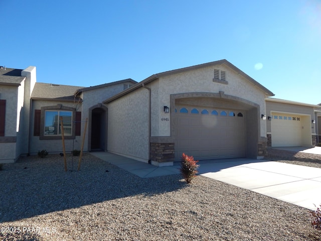 ranch-style home featuring a garage