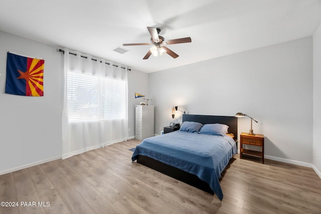 bedroom featuring light hardwood / wood-style flooring and ceiling fan