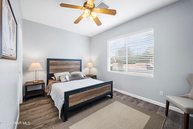 bedroom featuring ceiling fan and dark wood-type flooring