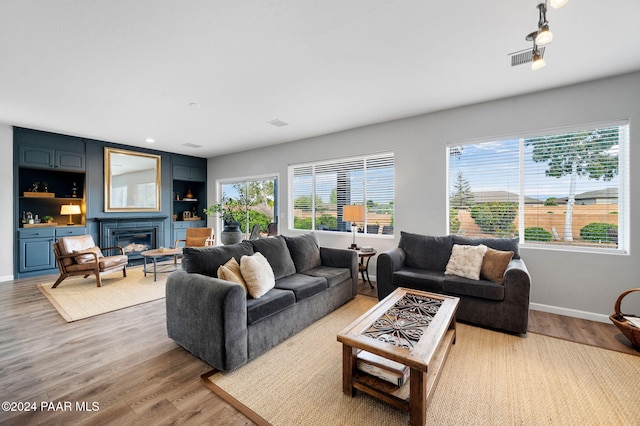 living room with light hardwood / wood-style flooring