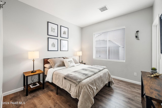 bedroom featuring dark wood-type flooring