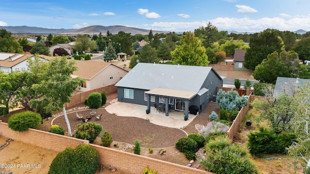 birds eye view of property featuring a mountain view