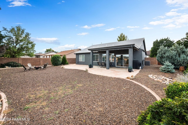 back of house with a patio area