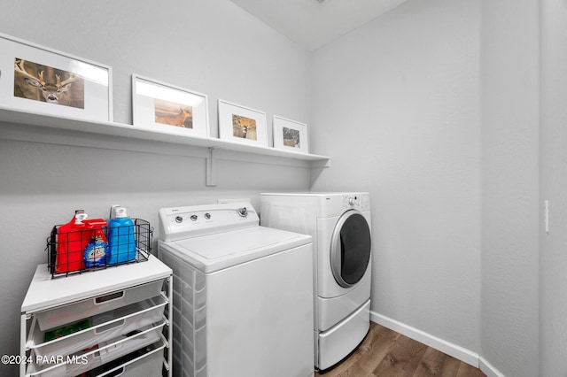 laundry area featuring dark hardwood / wood-style flooring and separate washer and dryer