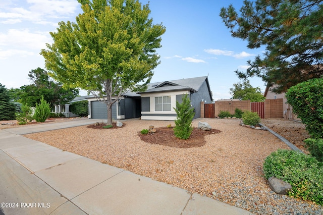 ranch-style home featuring a garage