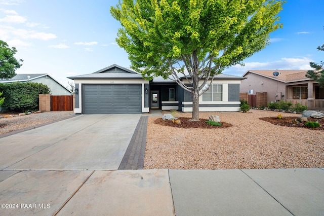 ranch-style home with a garage