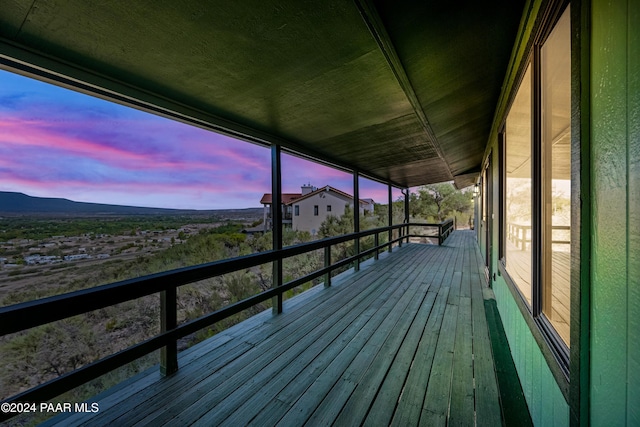 deck at dusk with a mountain view