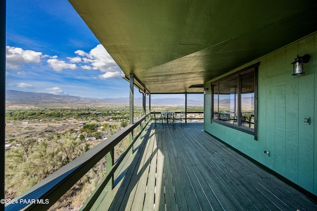 wooden terrace with a mountain view