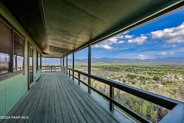 wooden deck with a mountain view