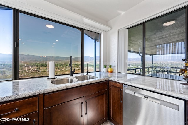 kitchen featuring dishwasher, a mountain view, a wealth of natural light, and sink