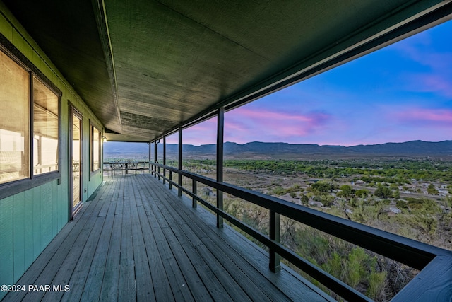 deck at dusk with a mountain view