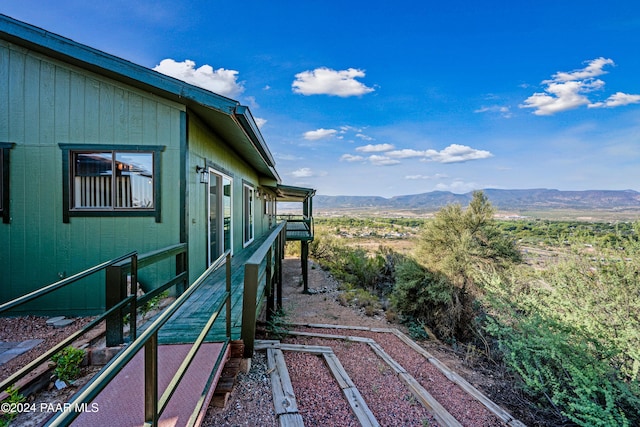 view of property exterior featuring a mountain view