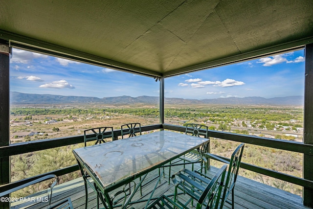 wooden terrace with a mountain view