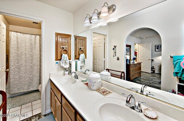 6174 N Viewpoint Dr, Prescott Valley, AZ 86314 - bathroom featuring tile patterned flooring, double vanity, visible vents, and a sink