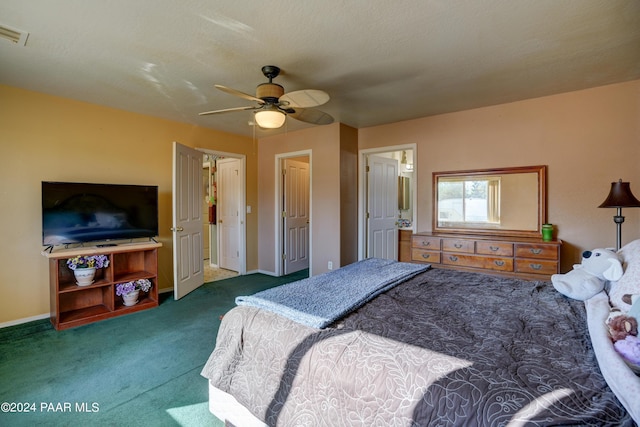 bedroom featuring ceiling fan and dark colored carpet