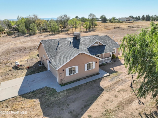 birds eye view of property with a rural view