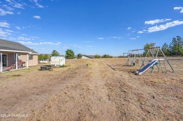 view of yard with a playground