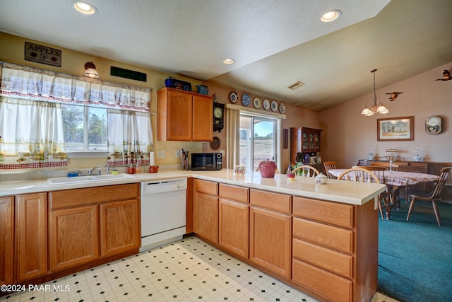 kitchen featuring dishwasher, hanging light fixtures, vaulted ceiling, a notable chandelier, and kitchen peninsula