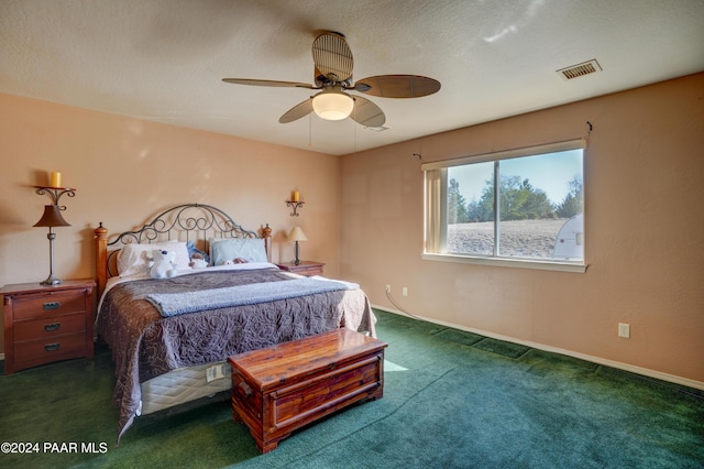 bedroom featuring dark colored carpet and ceiling fan