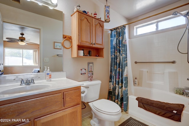 full bathroom featuring vanity, tile patterned flooring, ceiling fan, toilet, and shower / bath combo with shower curtain