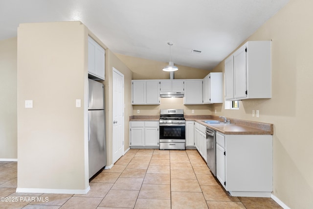 1870 Javelina Path, Chino Valley, AZ 86323 - kitchen with appliances with stainless steel finishes, under cabinet range hood, a sink, light tile patterned floors, and white cabinetry