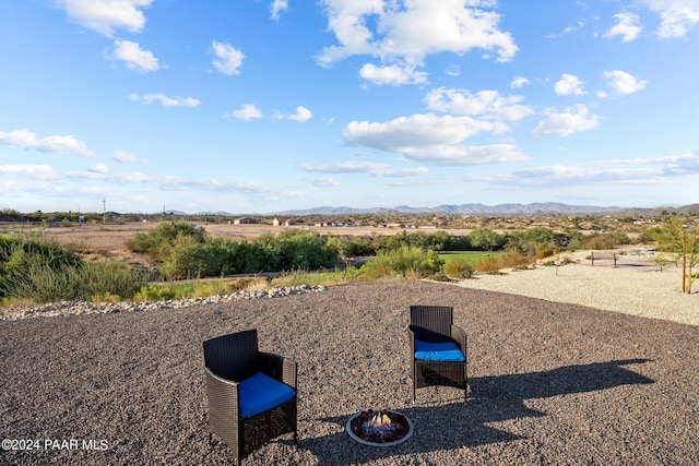 view of yard featuring a mountain view and a rural view