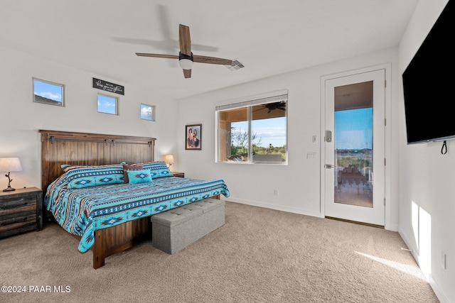 bedroom with ceiling fan, light carpet, and access to outside