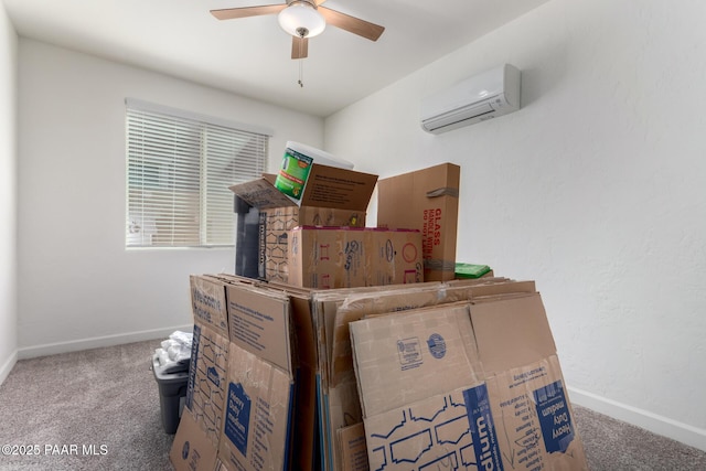 storage room featuring a ceiling fan and a wall unit AC