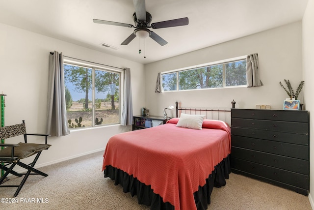 bedroom featuring ceiling fan and light colored carpet