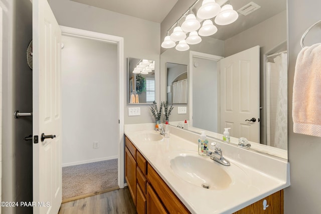 bathroom featuring vanity and hardwood / wood-style flooring