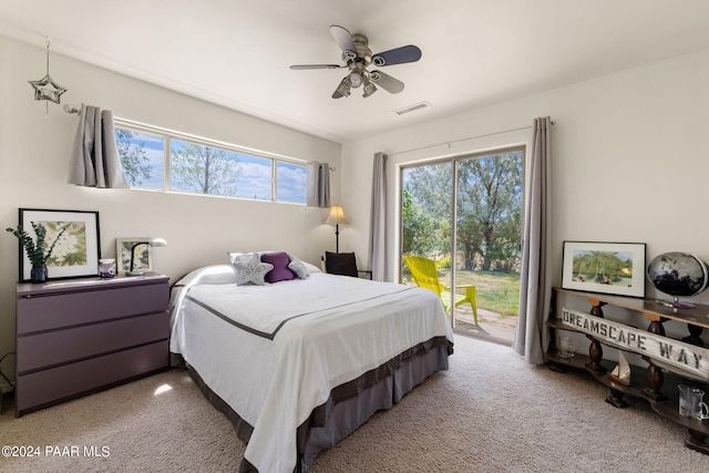 bedroom with ceiling fan, light colored carpet, and access to outside