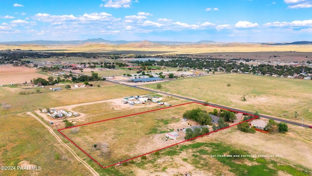 drone / aerial view featuring a mountain view and a rural view