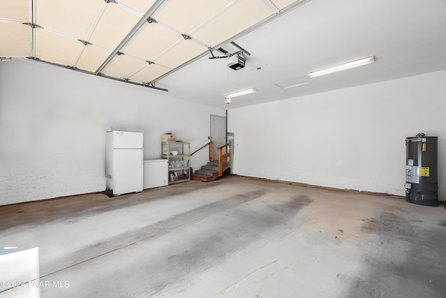 garage featuring white fridge, a garage door opener, and water heater