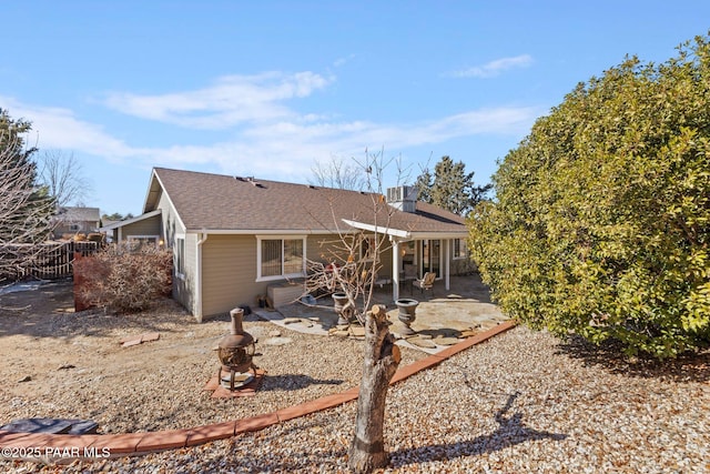 view of front of home with a patio and central air condition unit