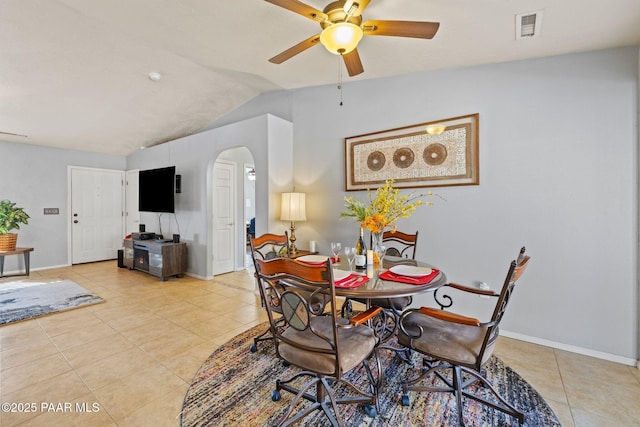 dining room featuring vaulted ceiling, light tile patterned floors, and ceiling fan