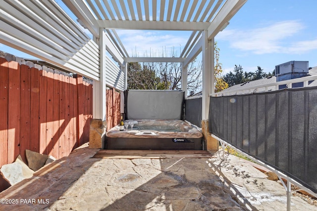 view of patio with a pergola and a covered hot tub