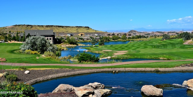 surrounding community featuring a water and mountain view