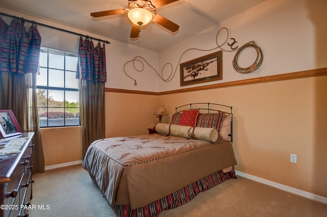 carpeted bedroom with baseboards and ceiling fan