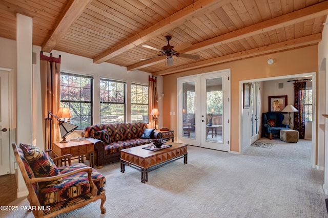carpeted living room with wooden ceiling, beamed ceiling, plenty of natural light, and french doors