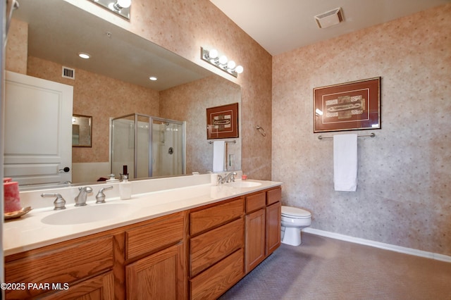 bathroom with a sink, wallpapered walls, and visible vents