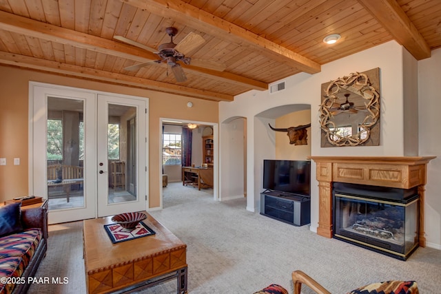 carpeted living room featuring french doors, wood ceiling, and visible vents