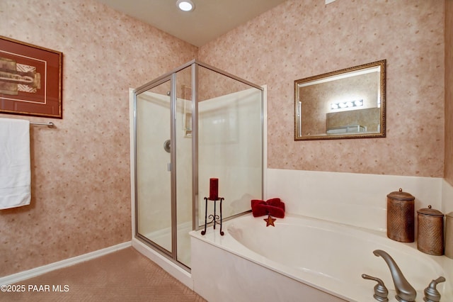 bathroom featuring baseboards, wallpapered walls, recessed lighting, a bath, and a stall shower