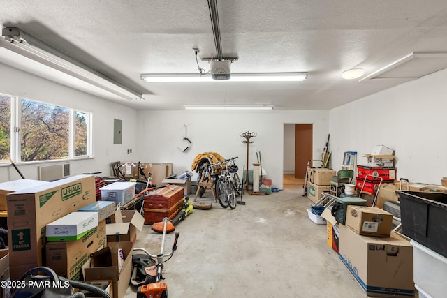 garage featuring a garage door opener and electric panel