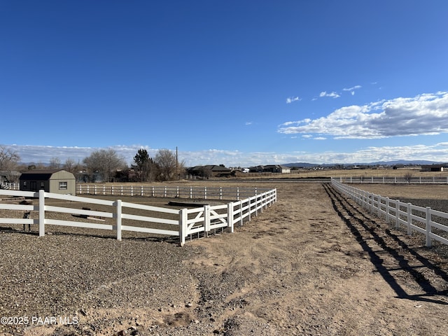 view of yard with a rural view