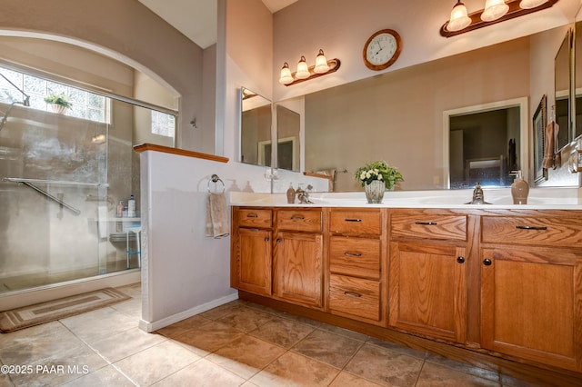 5461 N Bremont Way, Prescott Valley, AZ 86314 - bathroom featuring a shower with shower door, double vanity, and tile patterned flooring