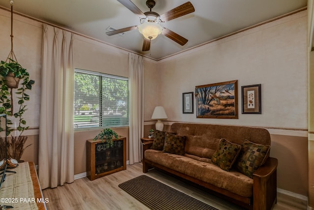 5461 N Bremont Way, Prescott Valley, AZ 86314 - living area with light wood-style flooring, ceiling fan, baseboards, and ornamental molding