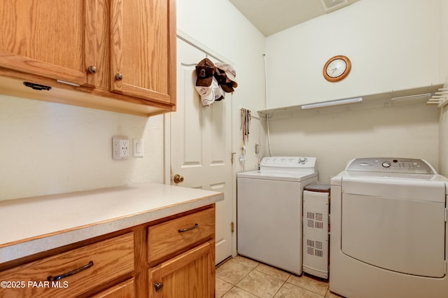 5461 N Bremont Way, Prescott Valley, AZ 86314 - laundry area with washer and dryer, light tile patterned floors, and cabinet space